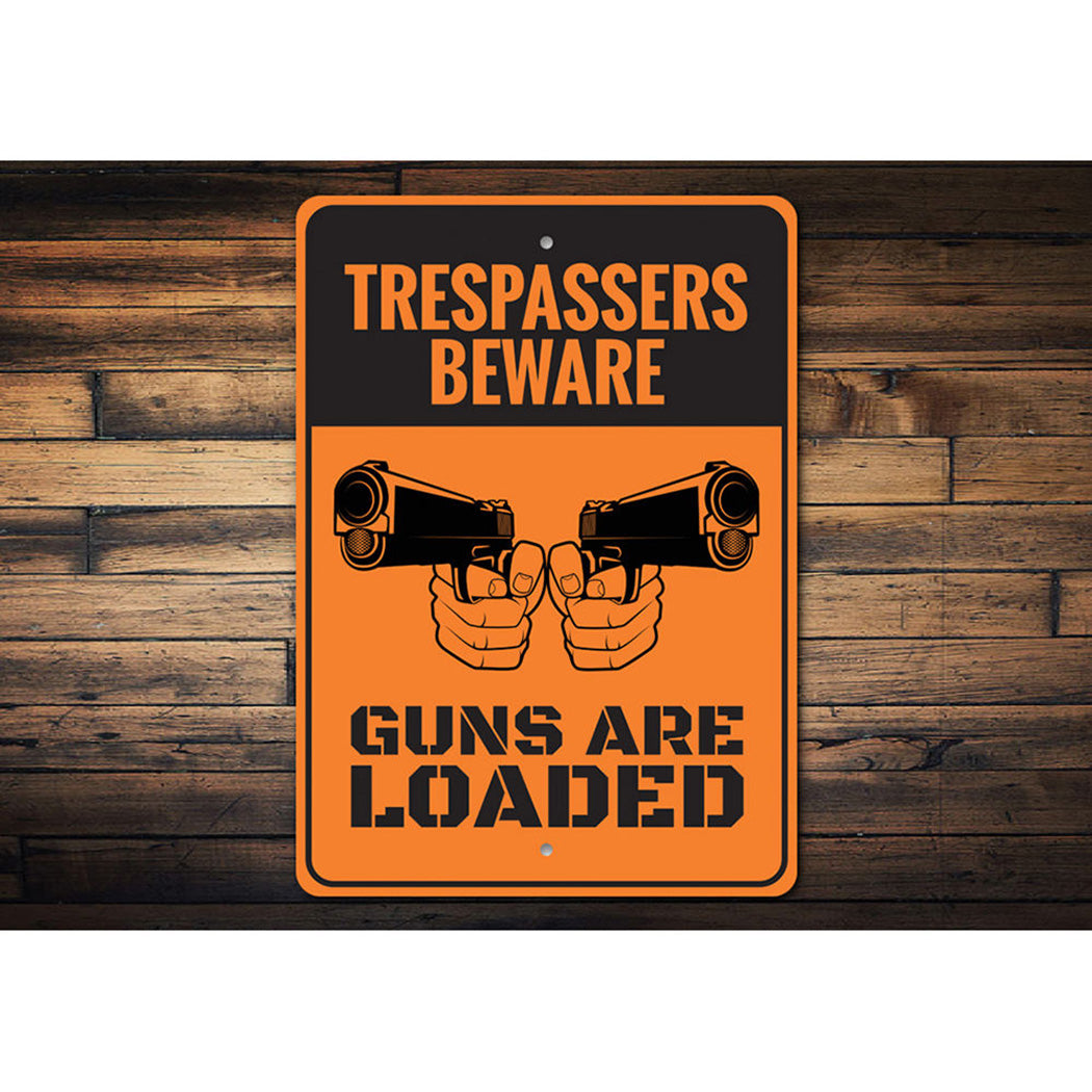 Trespassers Beware Guns are Loaded Sign