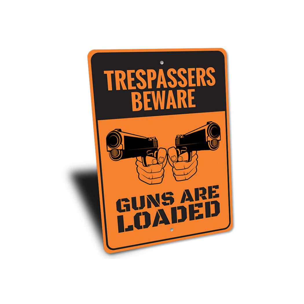 Trespassers Beware Guns are Loaded Sign