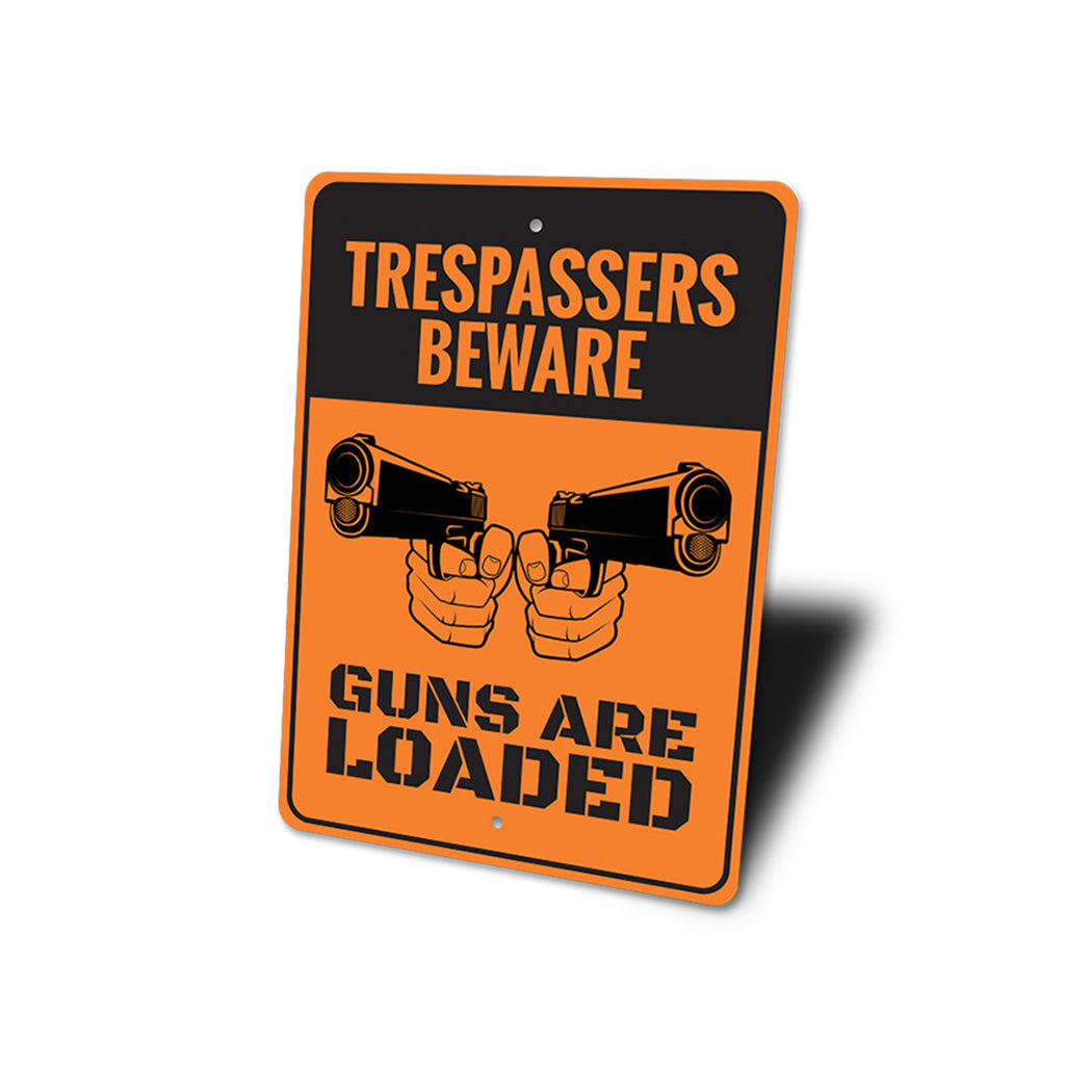 Trespassers Beware Guns are Loaded Sign