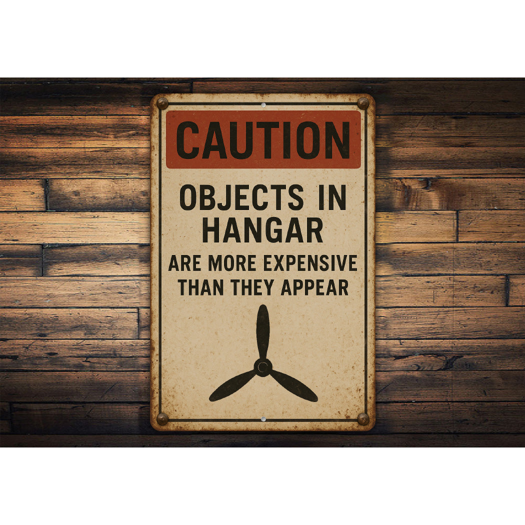 Caution Objects In Hangar Are More Expensive Sign