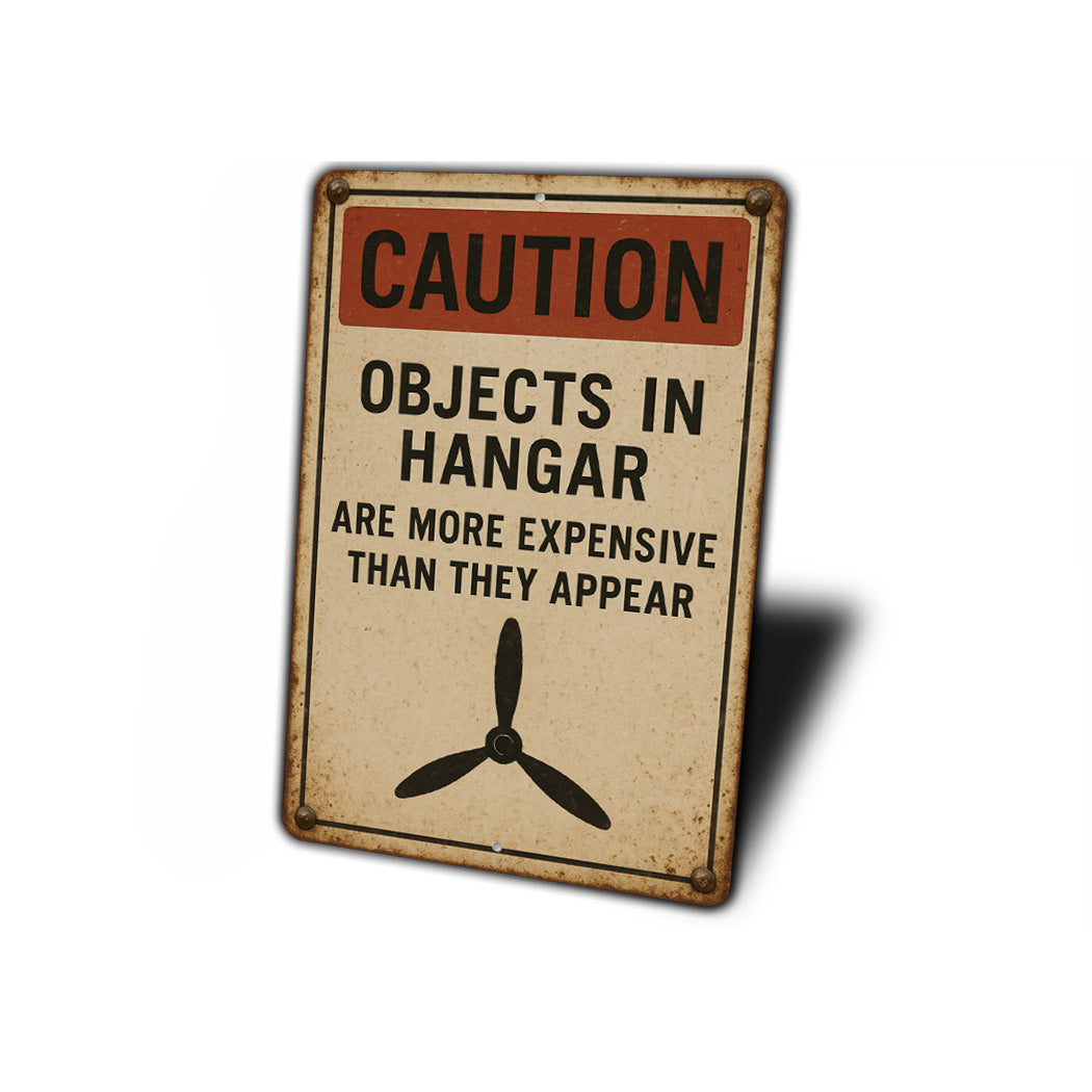 Caution Objects In Hangar Are More Expensive Sign