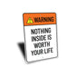 Nothing Inside is Worth Your Life Sign