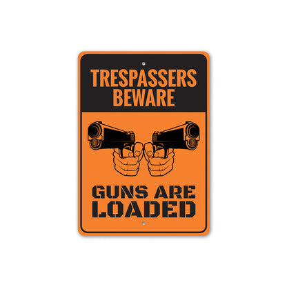 Trespassers Beware Guns are Loaded Sign