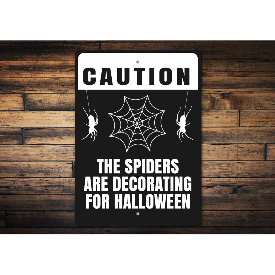The Spiders Are Decorating For Halloween Sign